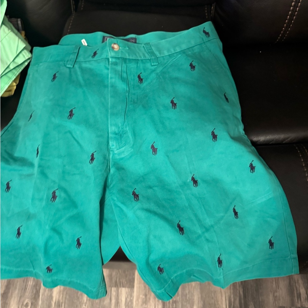 Men polo shorts great condition logo all over